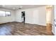 Bright living room featuring hardwood floors and neutral walls at 3446 S Clay St, Englewood, CO 80110