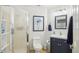 Bright bathroom with a walk-in shower and stylish blue vanity at 8653 E Dry Creek Rd # 1114, Englewood, CO 80112