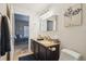 Bathroom with double vanity and view of the bedroom at 8653 E Dry Creek Rd # 1114, Englewood, CO 80112