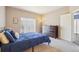 Inviting bedroom featuring a large window and ample closet space at 8653 E Dry Creek Rd # 1114, Englewood, CO 80112