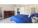 Comfortable bedroom with a sliding door and a view of the living room at 8653 E Dry Creek Rd # 1114, Englewood, CO 80112