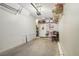 Spacious garage featuring ample storage space and an access door to the home's interior at 8653 E Dry Creek Rd # 1114, Englewood, CO 80112