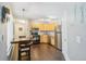 Kitchen with stainless steel appliances, wood cabinets, and a dining area at 8653 E Dry Creek Rd # 1114, Englewood, CO 80112