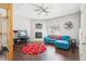 Bright living room with hardwood floors, fireplace, and a comfortable blue sectional sofa at 8653 E Dry Creek Rd # 1114, Englewood, CO 80112
