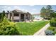 Backyard featuring a covered patio and spacious manicured lawn at 13087 W 27Th Ln, Golden, CO 80401