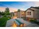 Stunning backyard with an outdoor seating area, fire pit, covered patio, and lush landscaping at 13087 W 27Th Ln, Golden, CO 80401