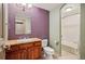 The stylish full bathroom features a granite countertop and shower with tub at 13087 W 27Th Ln, Golden, CO 80401