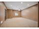 Spacious carpeted bedroom featuring ceiling fan, neutral walls, base trim and small window for natural light at 13087 W 27Th Ln, Golden, CO 80401