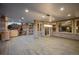 Spacious covered patio with a built-in grill, ample seating, and a view of the backyard at 13087 W 27Th Ln, Golden, CO 80401
