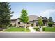 Charming brick home with manicured lawn and mature landscaping at 13087 W 27Th Ln, Golden, CO 80401