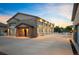 Large four-car garage with brick accents and ample driveway space at 13087 W 27Th Ln, Golden, CO 80401
