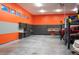 Garage interior featuring custom storage cabinets, car lifts, and painted walls at 13087 W 27Th Ln, Golden, CO 80401
