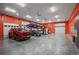 Spacious garage interior with car lifts, room for storage, and concrete floors at 13087 W 27Th Ln, Golden, CO 80401