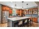 Beautiful kitchen featuring a spacious island with seating, stainless steel appliances, and custom cabinets at 13087 W 27Th Ln, Golden, CO 80401