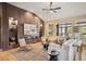 Cozy living room with custom wall, fireplace, large windows, modern furniture, and hardwood floors at 13087 W 27Th Ln, Golden, CO 80401