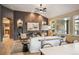 Elegant living room showcasing a fireplace, modern furnishings, built-in shelves, and seamless open space at 13087 W 27Th Ln, Golden, CO 80401