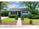 Charming home featuring a well-manicured front yard with lush landscaping and inviting curb appeal at 765 Iola St, Aurora, CO 80010