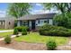 Charming home featuring a well-manicured front yard with lush landscaping and inviting curb appeal at 765 Iola St, Aurora, CO 80010