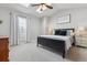 Cozy bedroom with natural light, ceiling fan, plush carpeting, and stylish decor at 6826 S Holland Way, Littleton, CO 80128