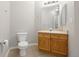 Bathroom featuring a standard toilet, vanity with cabinet, and neutral paint at 8358 S Independence # 107, Littleton, CO 80128