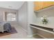 A built in desk is accented by light wood cabinets and an eye catching window at 8358 S Independence # 107, Littleton, CO 80128