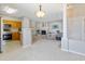 Bright, open-concept living area flowing into a kitchen with modern appliances at 8358 S Independence # 107, Littleton, CO 80128