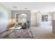 Spacious living room with large windows and an open floor plan at 8358 S Independence # 107, Littleton, CO 80128