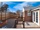 Cozy backyard featuring a wood deck with an outdoor rug and a privacy fence at 2301 E Yale Ave, Denver, CO 80210