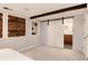 Finished basement with a bedroom area and a sliding door to the bathroom at 2301 E Yale Ave, Denver, CO 80210