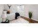 Cozy bedroom featuring a black accent blanket, rug, and modern decor at 2301 E Yale Ave, Denver, CO 80210