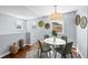 Bright dining area with a modern light fixture and neutral decor at 2301 E Yale Ave, Denver, CO 80210