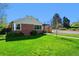 Charming brick home with a well-maintained lawn, showcasing curb appeal at 2301 E Yale Ave, Denver, CO 80210