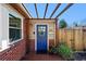 Charming blue front door with a decorative wreath and welcoming entrance at 2301 E Yale Ave, Denver, CO 80210