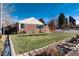 Well manicured front yard on a beautiful single Gathering house at 2301 E Yale Ave, Denver, CO 80210