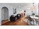 Open-concept living room featuring hardwood floors and stylish decor at 2301 E Yale Ave, Denver, CO 80210
