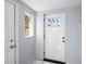 White door leading outside with a window, creating a bright space at 2301 E Yale Ave, Denver, CO 80210