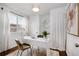 Inviting office space with a white desk, stylish chairs, and natural light at 2301 E Yale Ave, Denver, CO 80210