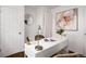 Comfortable office space with a white desk, and stylish décor at 2301 E Yale Ave, Denver, CO 80210