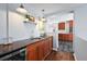 Stylish wet bar with wine fridge and convenient sink area, perfect for entertaining at 2301 E Yale Ave, Denver, CO 80210