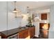 Stylish wet bar area with sleek countertops, wine fridge, and elegant lighting for entertaining guests at 2301 E Yale Ave, Denver, CO 80210