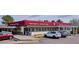 Exterior view of Tony's Meats & Specialty Foods with covered windows and parking at 7343 S Ivy Way, Centennial, CO 80112