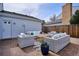 Relax on the brick patio with ample seating, perfect for entertaining friends and Gathering in the outdoor space at 7343 S Ivy Way, Centennial, CO 80112