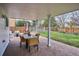 Enjoy the outdoor living space with a brick patio with an outdoor dining table and seating at 7343 S Ivy Way, Centennial, CO 80112