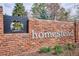 Brick sign that says 'homestead' with Covenant Community text in the corner at 7343 S Ivy Way, Centennial, CO 80112
