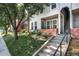 Charming townhome with a private entrance, complemented by lush landscaping and a well-manicured lawn at 1201 Galapago St # 109, Denver, CO 80204