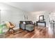 Comfortable living room features hardwood floors, a gray sectional couch, and stylish decor at 1201 Galapago St # 109, Denver, CO 80204