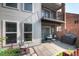 View of the outdoor patio with a grill, furniture, and plants at 1201 Galapago St # 109, Denver, CO 80204