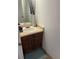 Compact bathroom features a vanity with modern fixtures and neutral decor at 4663 S Fraser Ct # C, Aurora, CO 80015