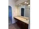 Bathroom vanity featuring a large mirror, lighting, and plenty of counter space at 4663 S Fraser Ct # C, Aurora, CO 80015