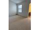 Bright bedroom with standard window and access to an en-suite bathroom at 4663 S Fraser Ct # C, Aurora, CO 80015